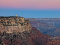 Full moon sets at sunrise  Grand Canyon 