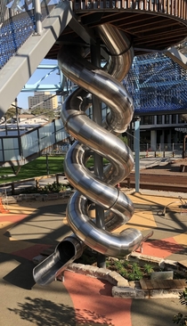 Giant double helix stainless steel slide Public playspace Sydney AU