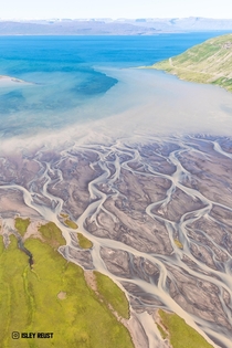 Glacial river flowing into the Westfjords of Iceland  isleyreust