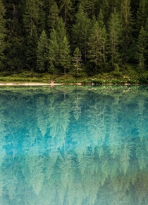 Glass-like reflections in Lago di Sorapis Italy 