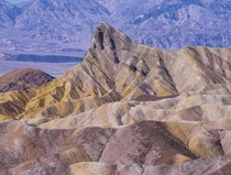 Golden colored badlands at Zabriskie point Death Valley -California x