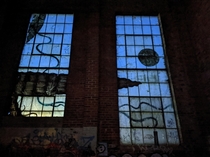 Graffiti on windows in an abandoned building
