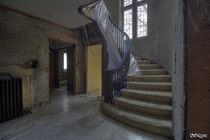 Grand Staircase Inside an Vacant Tudor Revival Mansion That is Being Saved 