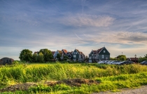 Group of typical old-style Dutch houses in Marken The Netherlands 