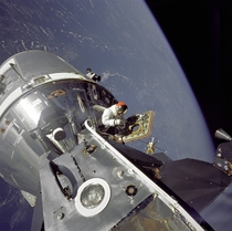 Gumdrop meets Spider March   Apollo  CommandService Modules nicknamed Gumdrop and Lunar Module nicknamed Spider are shown docked together in this photo by Lunar Module pilot Russell L Schweickart as Command Module pilot David Scott stands in the open hatc