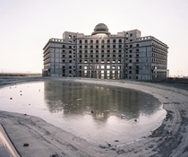 Half-constructed hotel in the development zone of Turpan city Xinjiang province China  