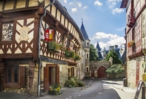 Half-timbered house and medieval castle in Josselin Morbihan France 