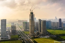 Hangzhou China Skyscrapers rise between rice paddies 
