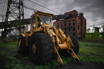 Heavy equipment left on blocks of wood at the site of an old steel plant