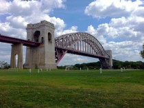 Hell Gate Bridge with cricket players Ward Island New York City 