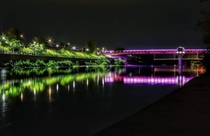 Here is a shot of the iconic landmark for Cambridge Ontario The pedestrian bridge in downtown Galt was donated a light kit rgb that changes colour once a week throughout the year The pic is oc by my sons father who would rather remain anonymous x