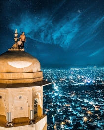 High above the city lights of Jaipur India from the turrets of Nahargarh Fort by Jacob Riglin 