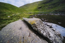 Hike all the way to this tarn and the thing Im most excited about is this rock Bowscale Tarn Lake District England 