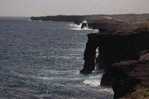 Hlei sea arch and a raging coast in Volcanos National Park 