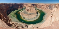 Horseshoe Bend a meander of the Colorado River in the Glen Canyon National Recreation Area located  miles  km downstream from the Glen Canyon Dam and Lake Powell near the town of Page Arizona It is accessible via hiking trail or an access road Photo Chris