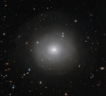 Hubble Space Telescope has captured this image of PGC  an example of a lenticular galaxy  a galaxy type that lies on the border between ellipticals and spirals 