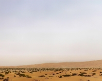 I am in the Liwa Dunes in the southern United Arab Emirates That haze in the background is sand blown up by  mph winds 