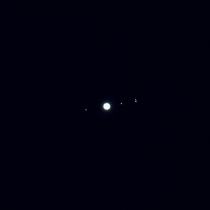 I pointed my telephoto lens at Jupiter out my apartment window and I could see its moons