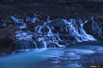 I was looking for the northern lights last week but it was too bright even at  am Disappointed I shot this waterfall instead Hraunfossar at twilight giving it a surreal look Iceland 