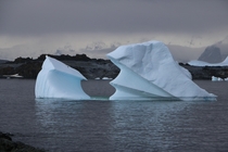 Iceberg with mountains Antarctic Peninsula 