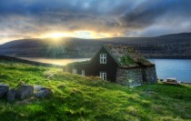 Icelandic hut with grass roof at sunrise 