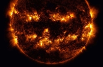 In this photo released by NASA combined active regions of the sun resemble a jack-o-lanterns face