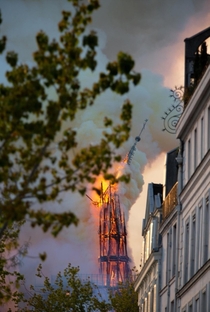 Incredible and sad photo of the spire of Notre-Dame de Paris collapsing France 