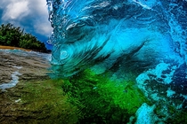 Inside a wave breaking on the shore in Kauai 