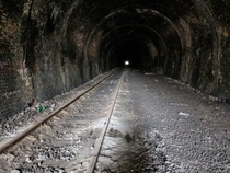 Inside an Abandoned Railway Tunnel with track in the UK