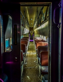 Inside an abandoned train car The purple lighting was due to spray paint and paper over the windows