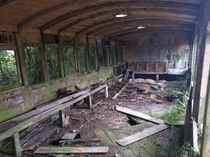 Inside of abandoned XIX century passenger car converted to waiting room
