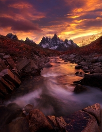 Into the Flames - sunset over the Ogilvie Mountains in Canadas Yukon Territory  by Marc Adamus
