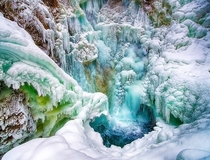 Its hot out there so how about some cold Partially frozen Thunder Bird Falls in Alaska USA 