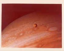 Jupiter and its satellite Io taken by Voyager  June  