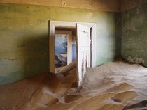 Kolmanskop is a ghost town in Namibia that is slowly being consumed by sand From  to  it was the site of a diamond mine and was home to the first x-ray-station in the southern hemisphere as well as the first tram in Africa  by Damien du Toit