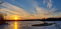 Late Winter sunset over frozen Nimisila Reservoir Akron Ohio February   