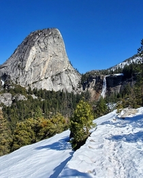 Liberty Cap and Nevada Fall with some white stuff Yosemite National Park CA USA 