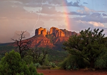 Lightning and a rainbow gracing Cathedral Rock in Sedona Arizona  photo by Guy Schmickle