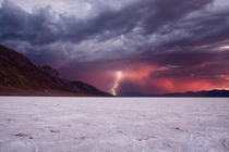 Lightning strikes at sunset in Death Valley by Jeff Engelhardt 