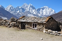 Like a scene out of Lord of the Rings an abandoned shack on the Great Himalayan Trail Nepal 