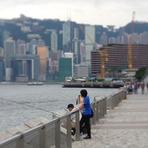 Locals fishing with the Hong Kong skyline in the background x