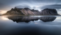 Long exposure of Vestrahorn the sea and some amazing lenticular clouds  tristantodd