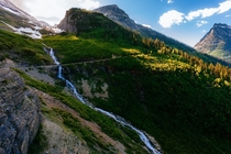 Long trickling waterfall through Logan Pass Glacier National Park MT 