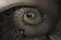 Looking up the staircase of a derelict manor house  Photographed by Andre Govia