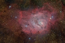 M The Lagoon Nebula -- Twisting near the center of the Lagoon the small bright hourglass shape is the turbulent result of extreme stellar winds and intense starlight 