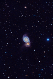 M The Whirlpool Galaxy gobbling up its galactic neighbor details in comments 
