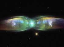 M- Wings of a Butterfly Nebula -- In the center two stars orbit inside a gaseous disk  times the orbit of Pluto The expelled envelope of the dying star breaks out from the disk creating the bipolar appearance 