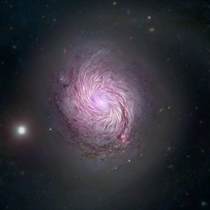 Magnetic fields in NGC  or M are shown as streamlines over a visible light and X-ray composite image of the galaxy
