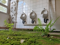 Mens Room in abandoned soviet army barracks close from Berlin Germany