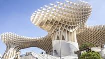 Metropol Parasol is a wooden structure at La Encarnacin square in Seville Spain Designed by German architect Jrgen Mayer April  The structure consists of six parasols in the form of giant mushrooms whose design is inspired by the vaults of the Cathedral o